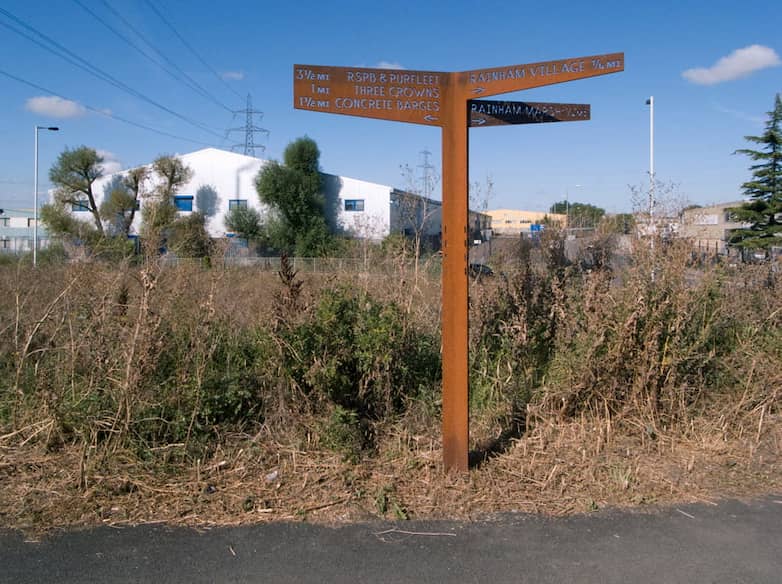 New path signage fabricated from weathering steel with cutout lettering